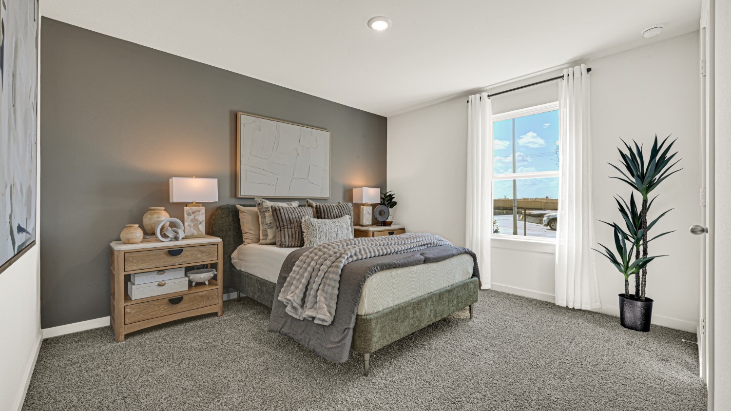 Guest bedroom 1 with front windows and ample natural light