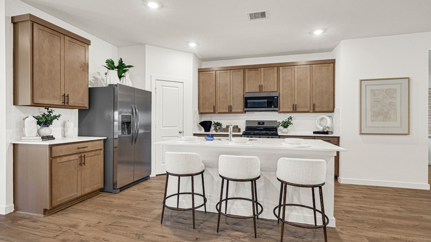Spacious open concept kitchen with island and counter prep space