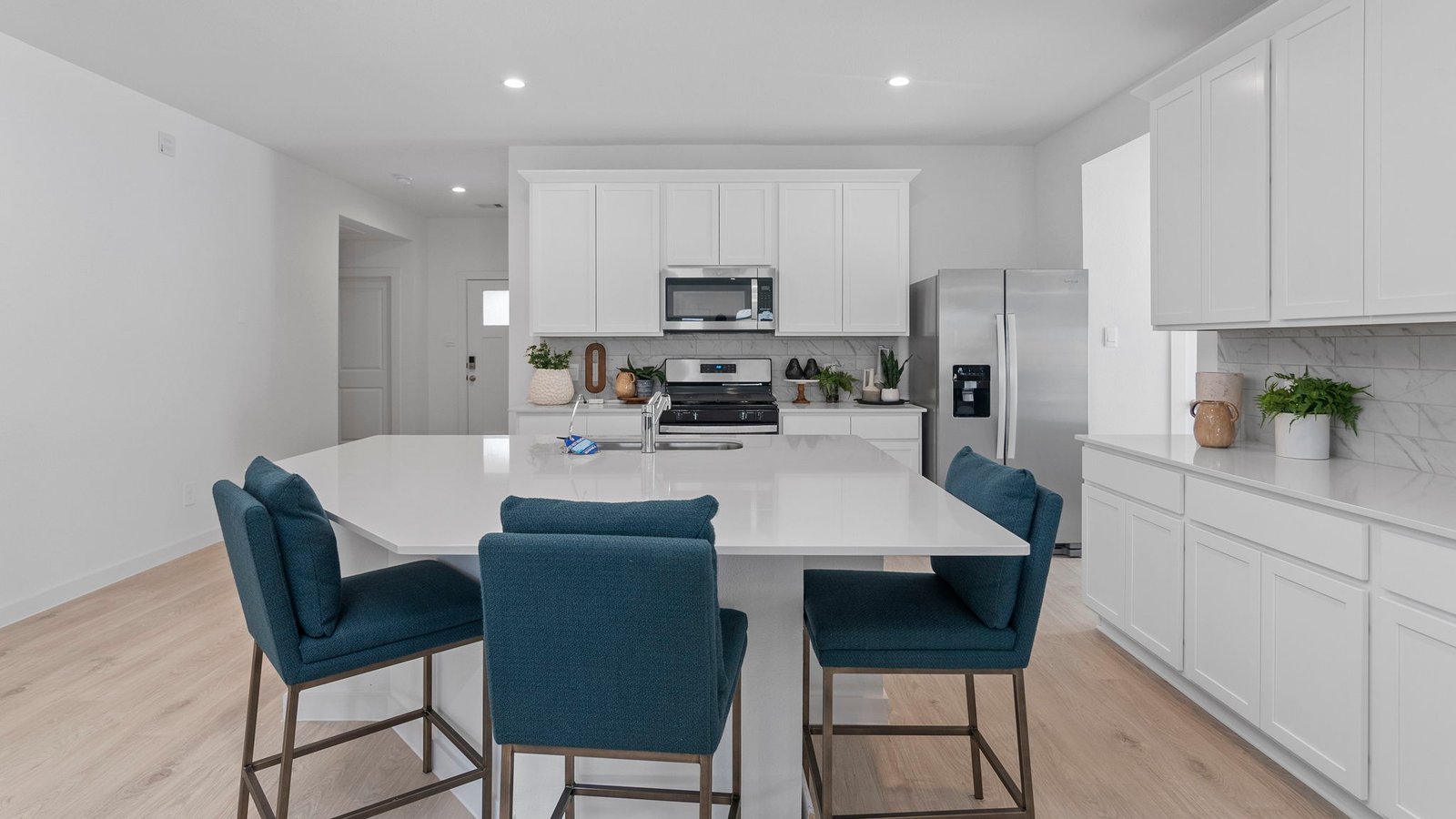 Spacious open concept kitchen with island and counter prep space