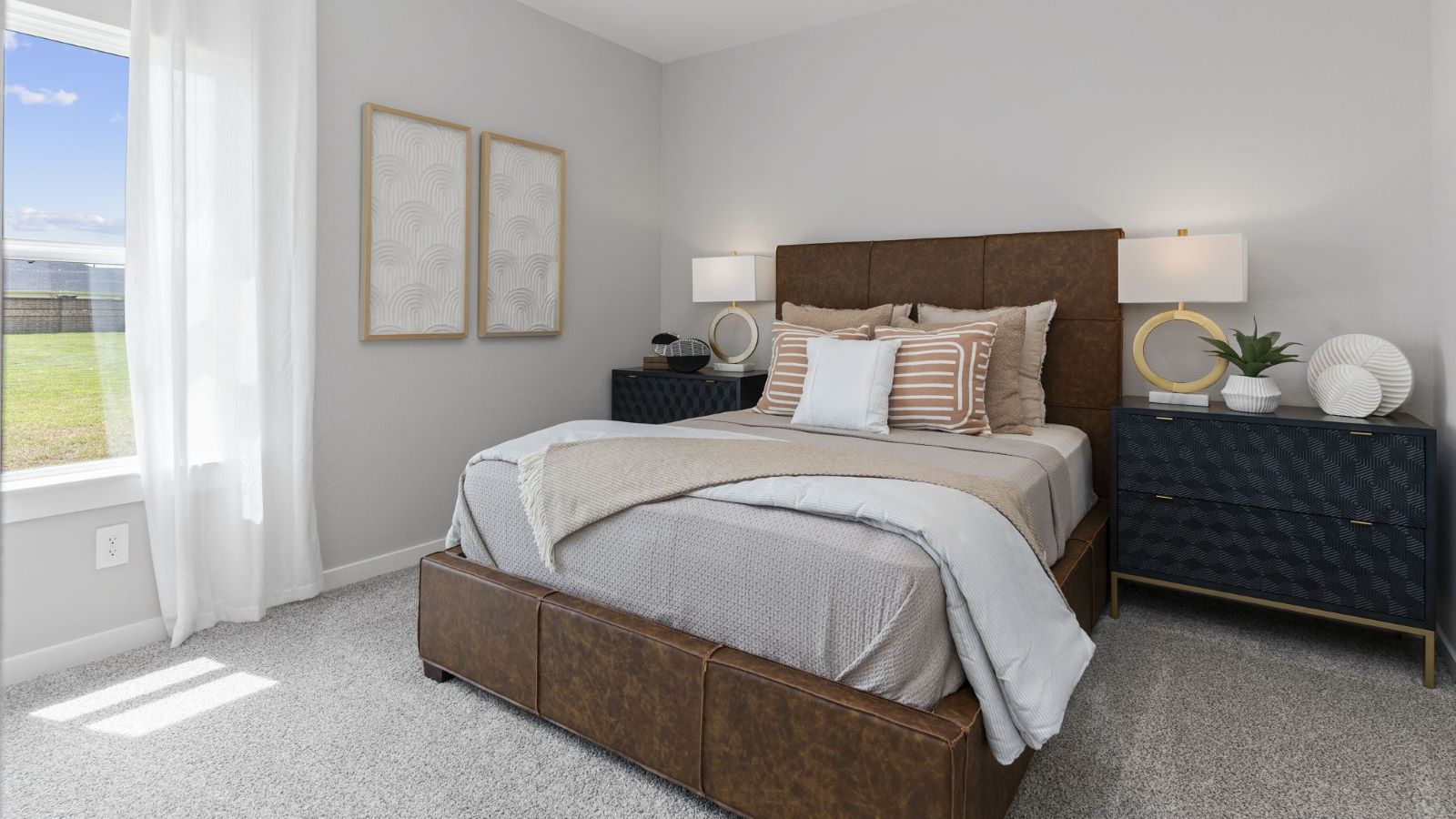 Guest bedroom 1 with front windows and ample natural light