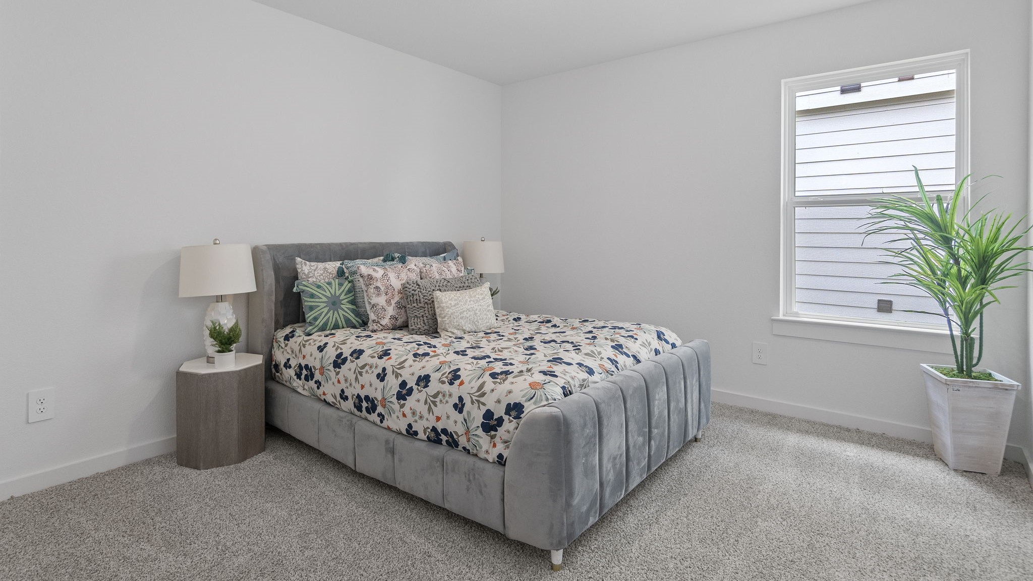 Guest bedroom 1 with front windows and ample natural light