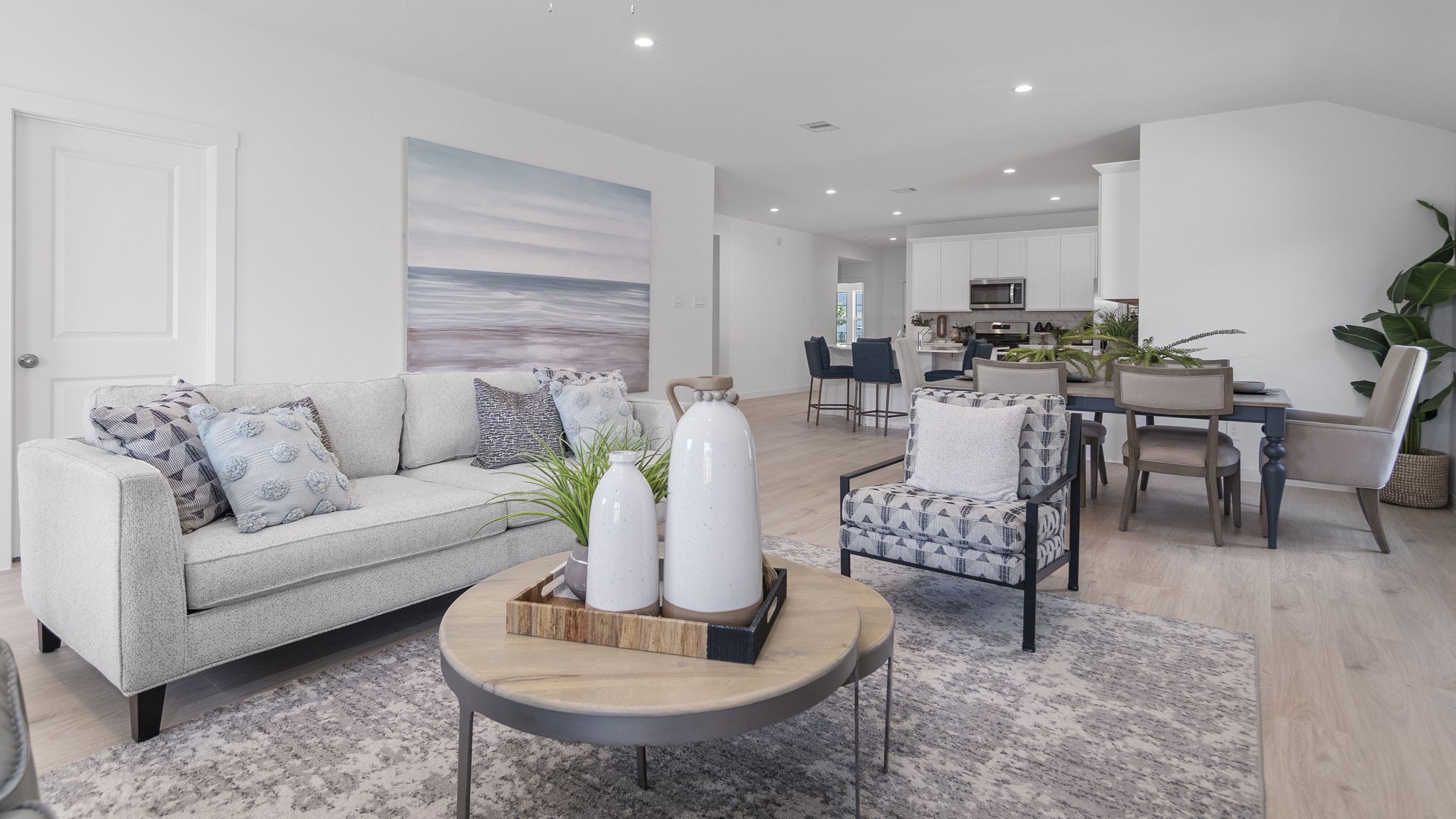 Spacious living and family room space with light allowing windows