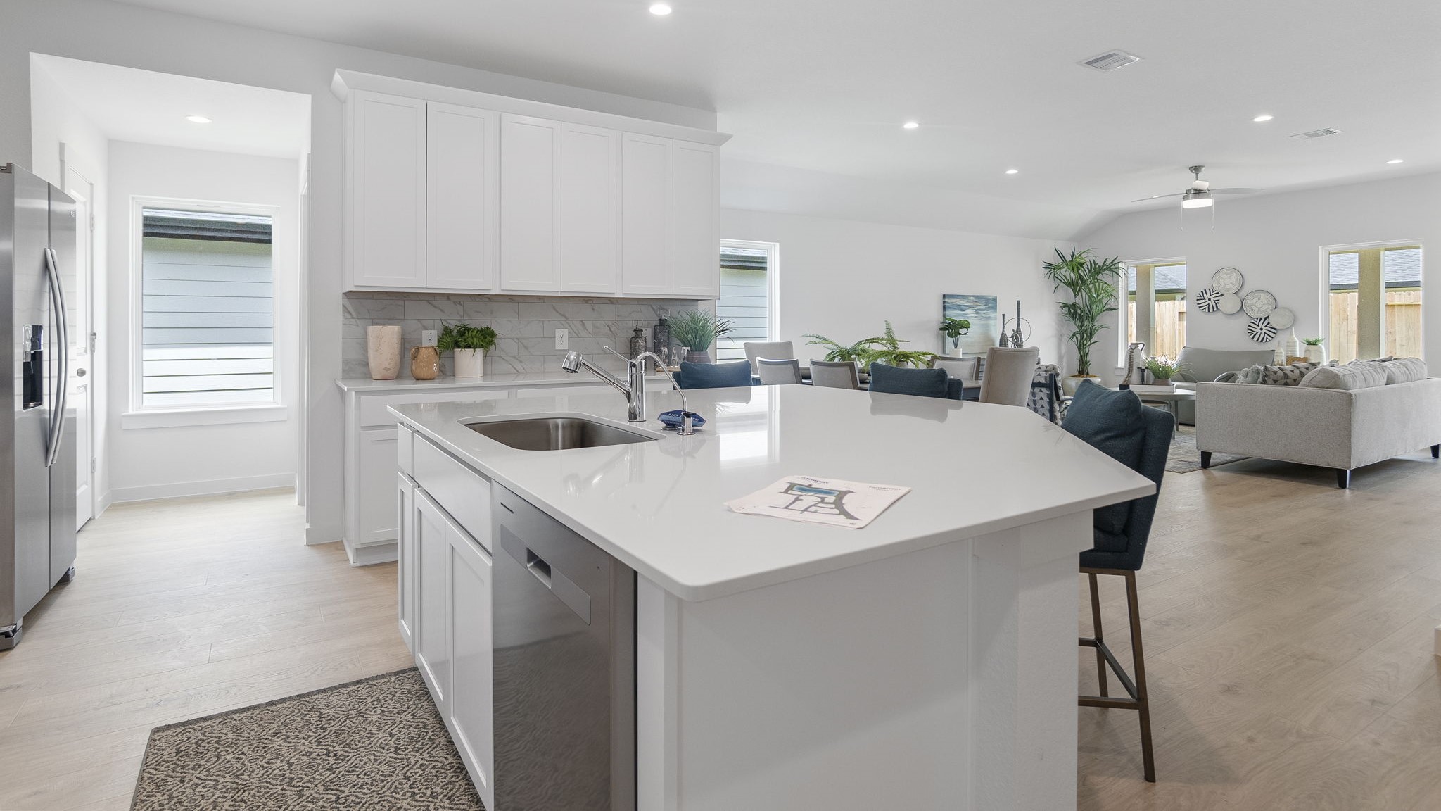 Spacious open concept kitchen with island and counter prep space