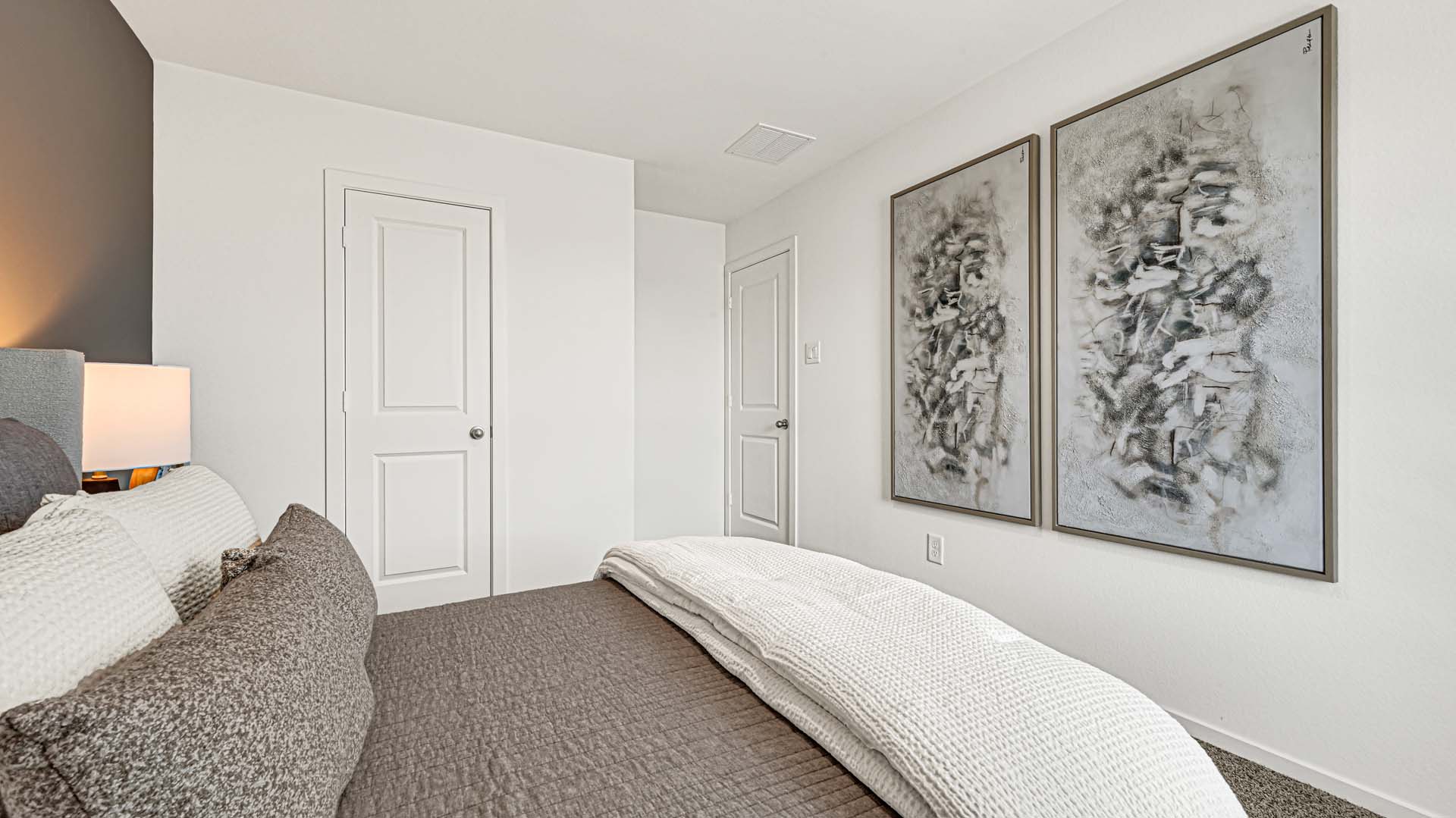 Upstairs guest bedroom 2 with plush carpeted floors and ample natural light