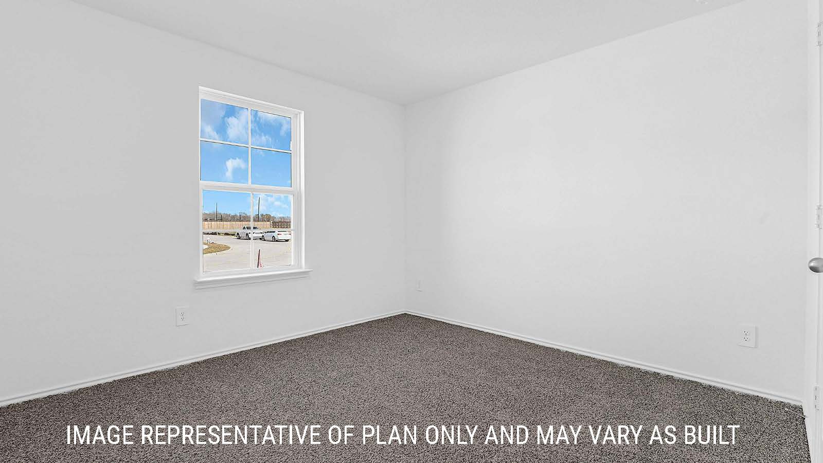 Fairfield secondary bedroom with carpeted flooring and window for natural lighting.