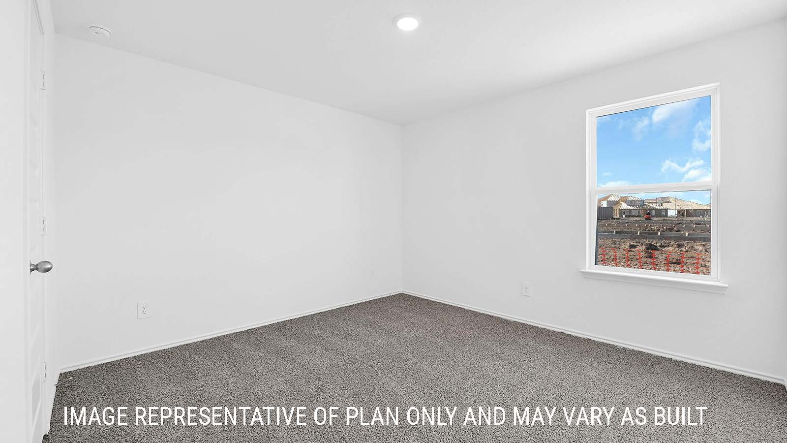 Fairfield secondary bedroom with carpeted flooring and window for natural lighting.