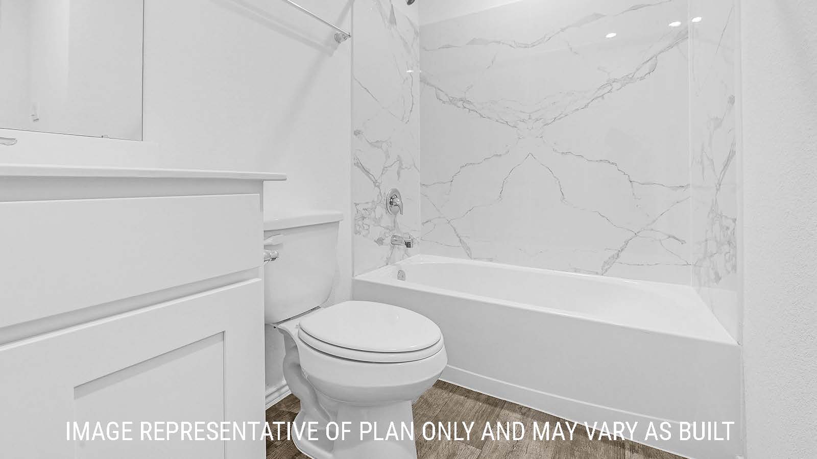 Fairfield secondary bathroom with vanity sink and shower and tub combo.