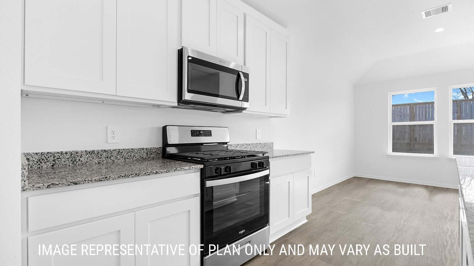 Fairfield kitchen with white cabinets and granite countertops.