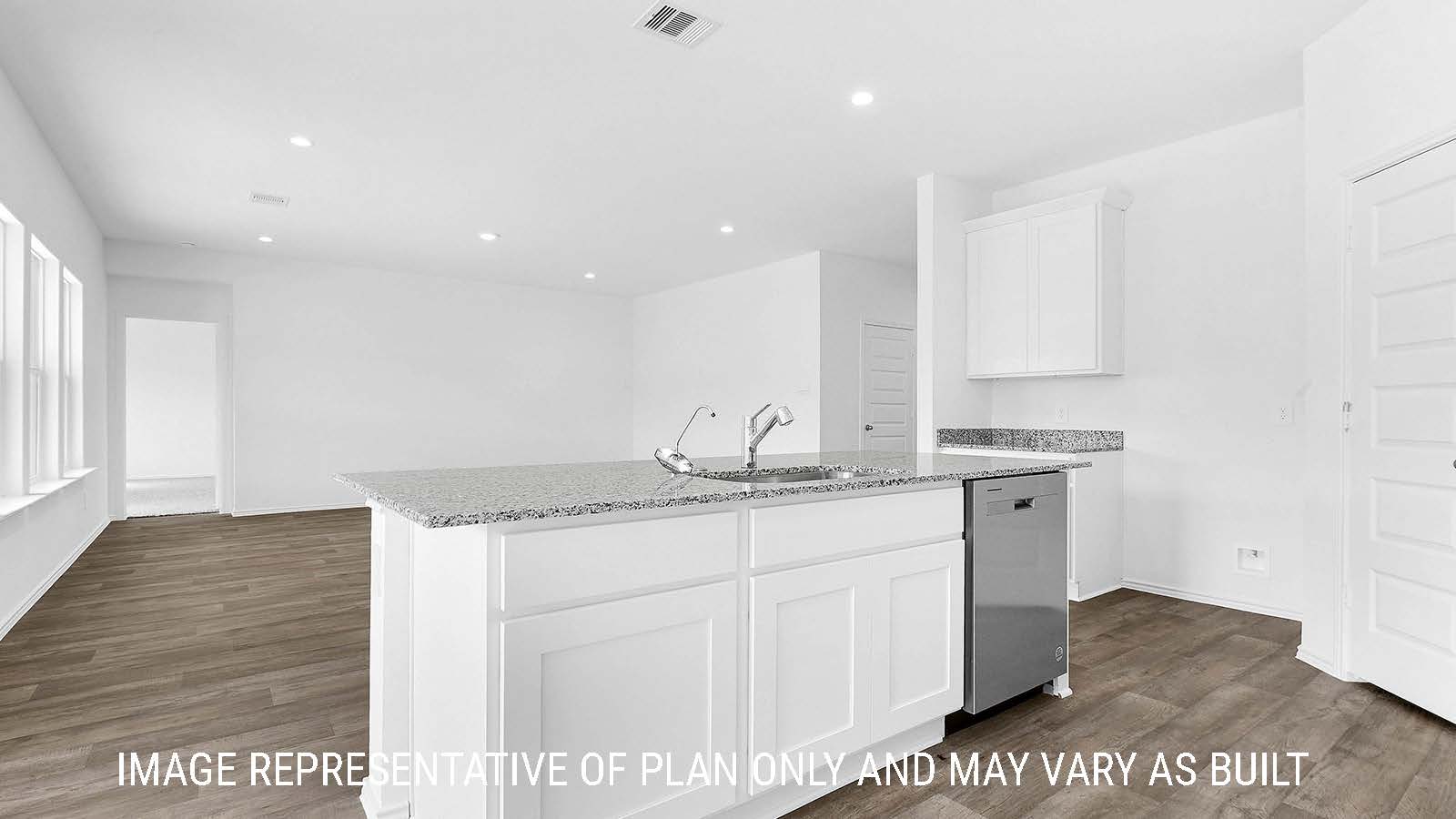 Fairfield kitchen with kitchen island with granite countertop with view of living room.