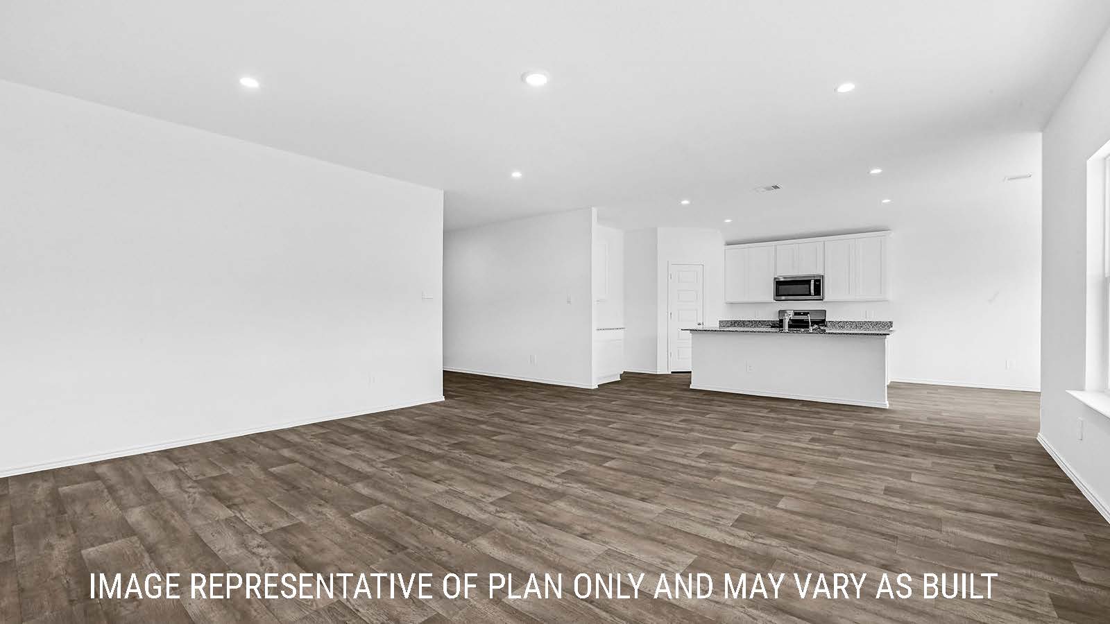 Fairfield living room with vinyl plank flooring and view of kitchen and dining room.