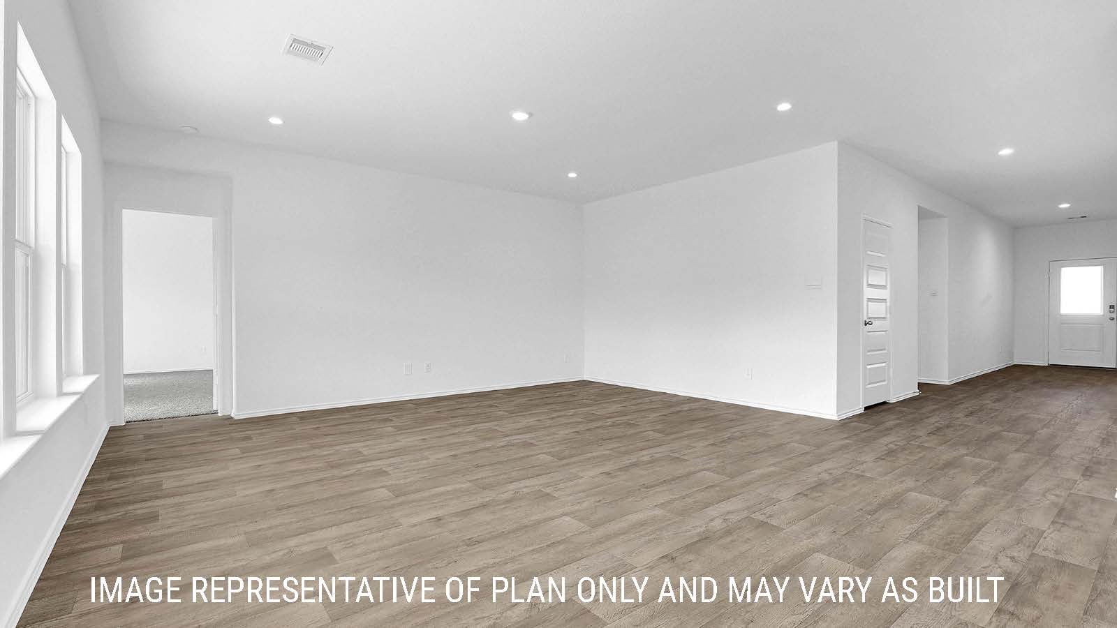 Fairfield living room with vinyl plank flooring and view of front door.