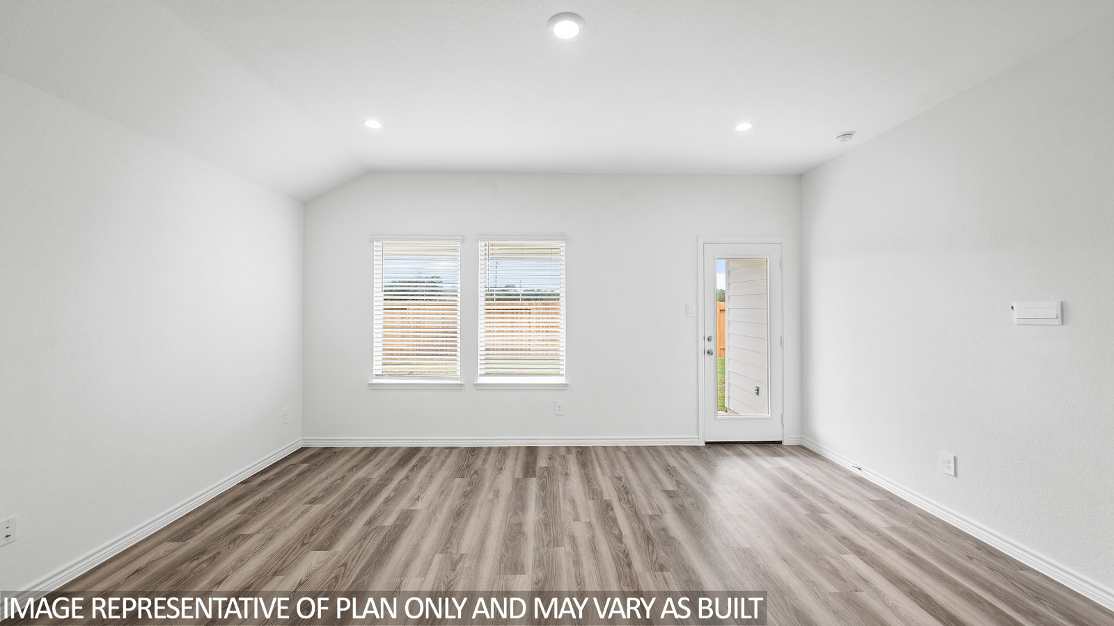 Harris living room with vinly plank flooring and view to backyard.