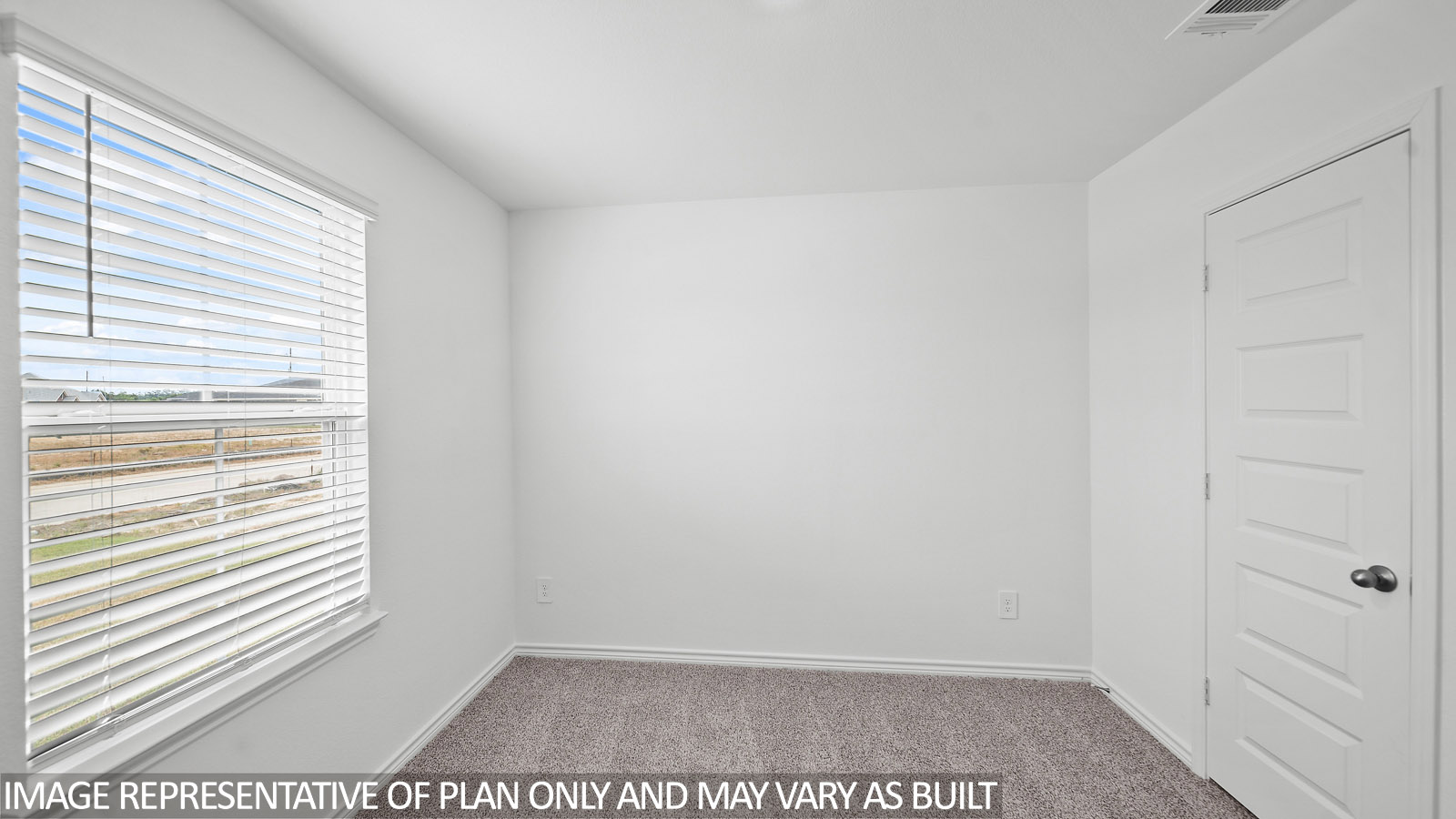 Harris secondary bedroom with carpet and window.