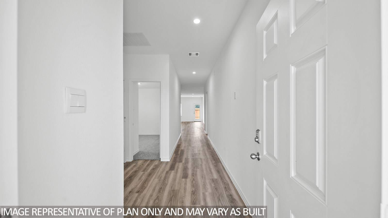 Harris entry way with vinyl plank flooring and view to living room.