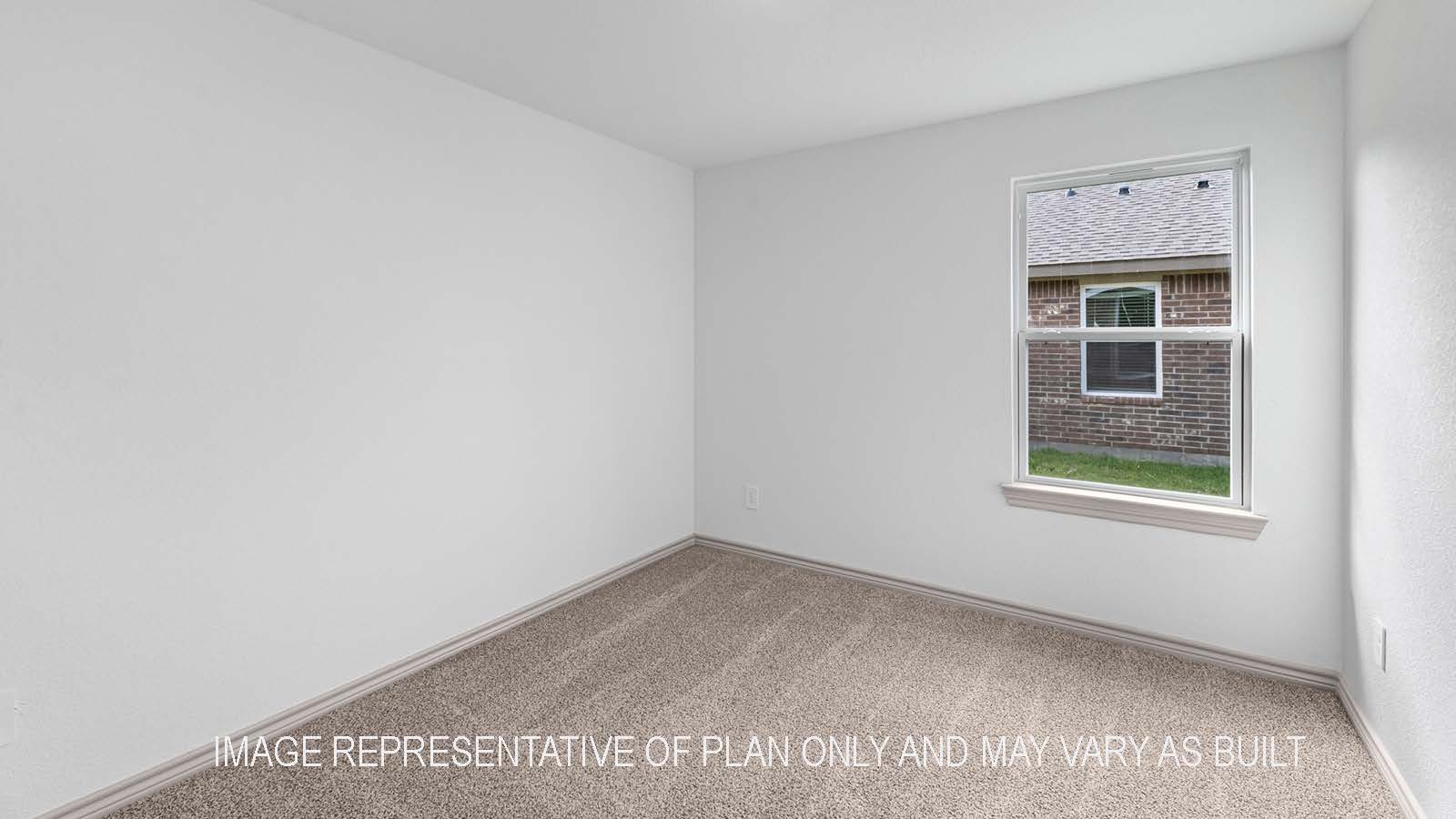 Camden secondary bedroom with carpet flooring and window with outside view.