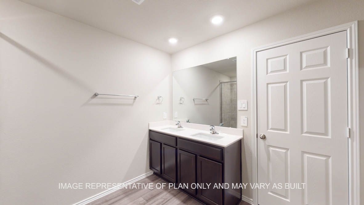 Kingston primary bathroom with white granite countertops.