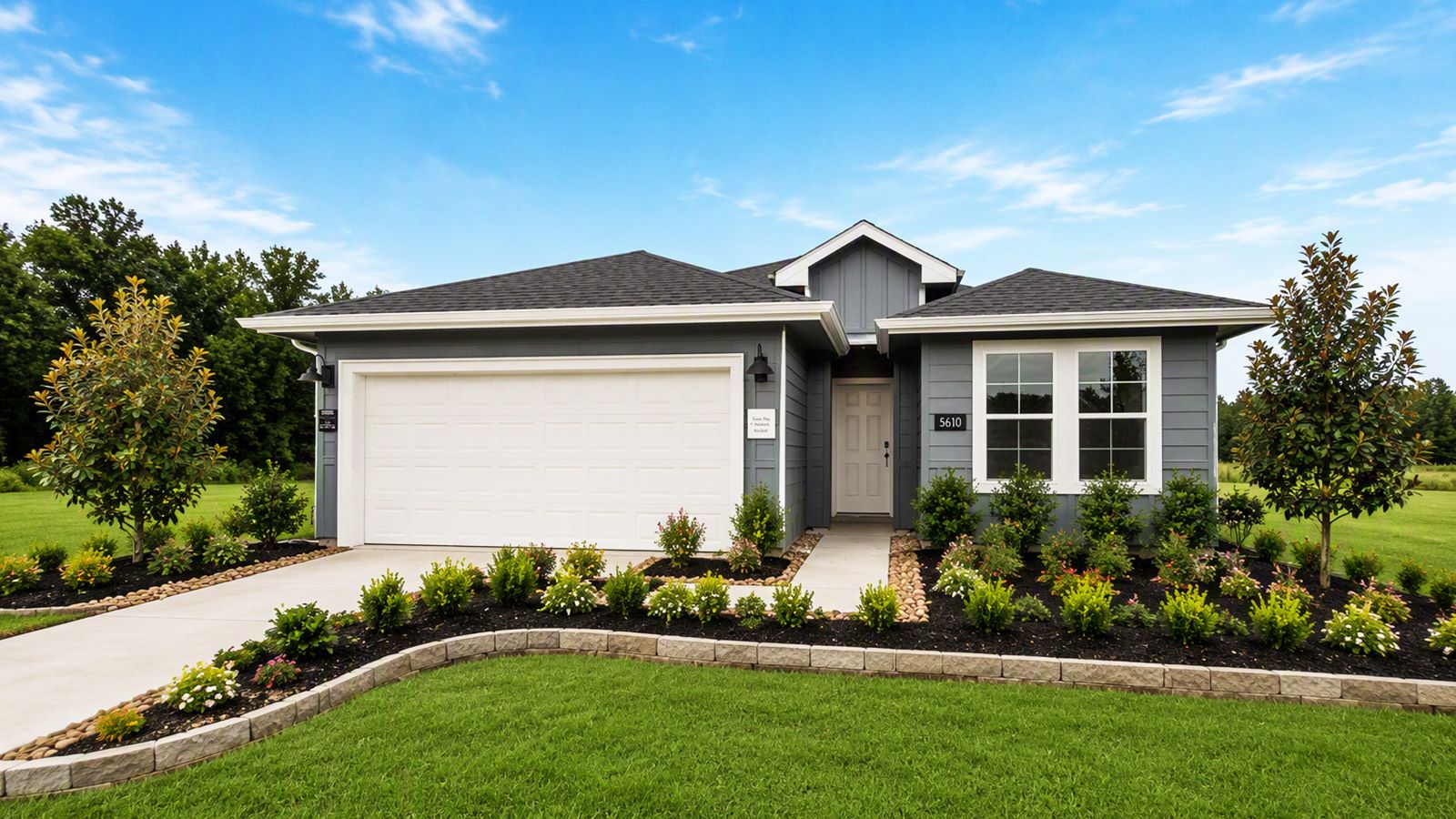 Reserve at Mallard Lakes model home exterior elevation front view with landscape.