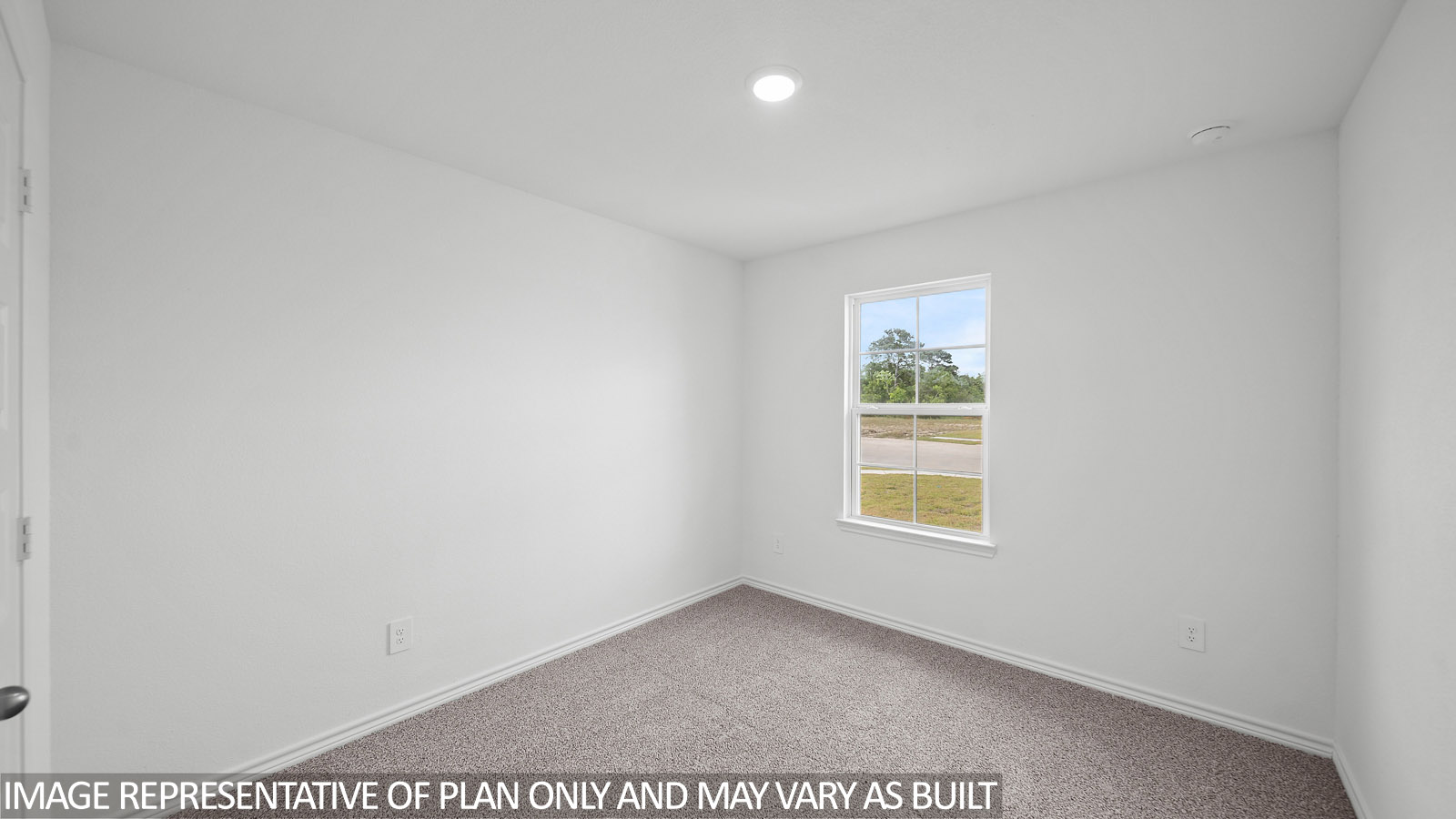 Baxtor secondary bedroom with carpet flooring and window.