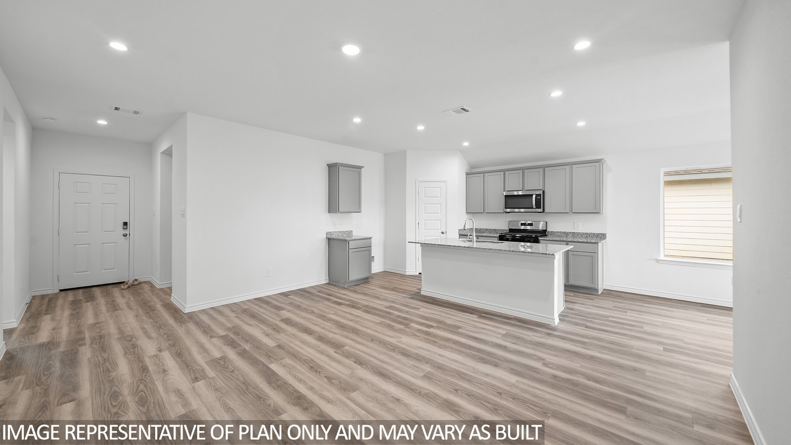 Baxtor open concept kitchen and family room with vinyl plank flooring.