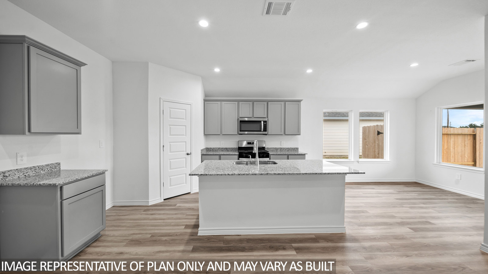 Baxtor kitchen with spacious vinly plank flooring, gray cabinets and granite countertops.