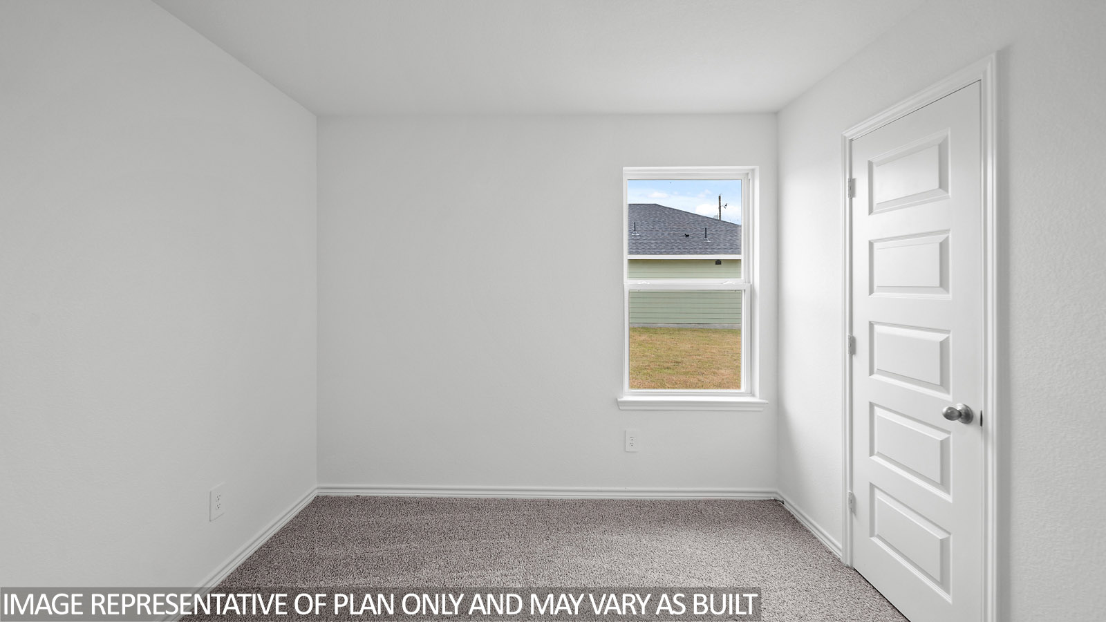 Gaven secondary bedroom with carpet flooring and window.