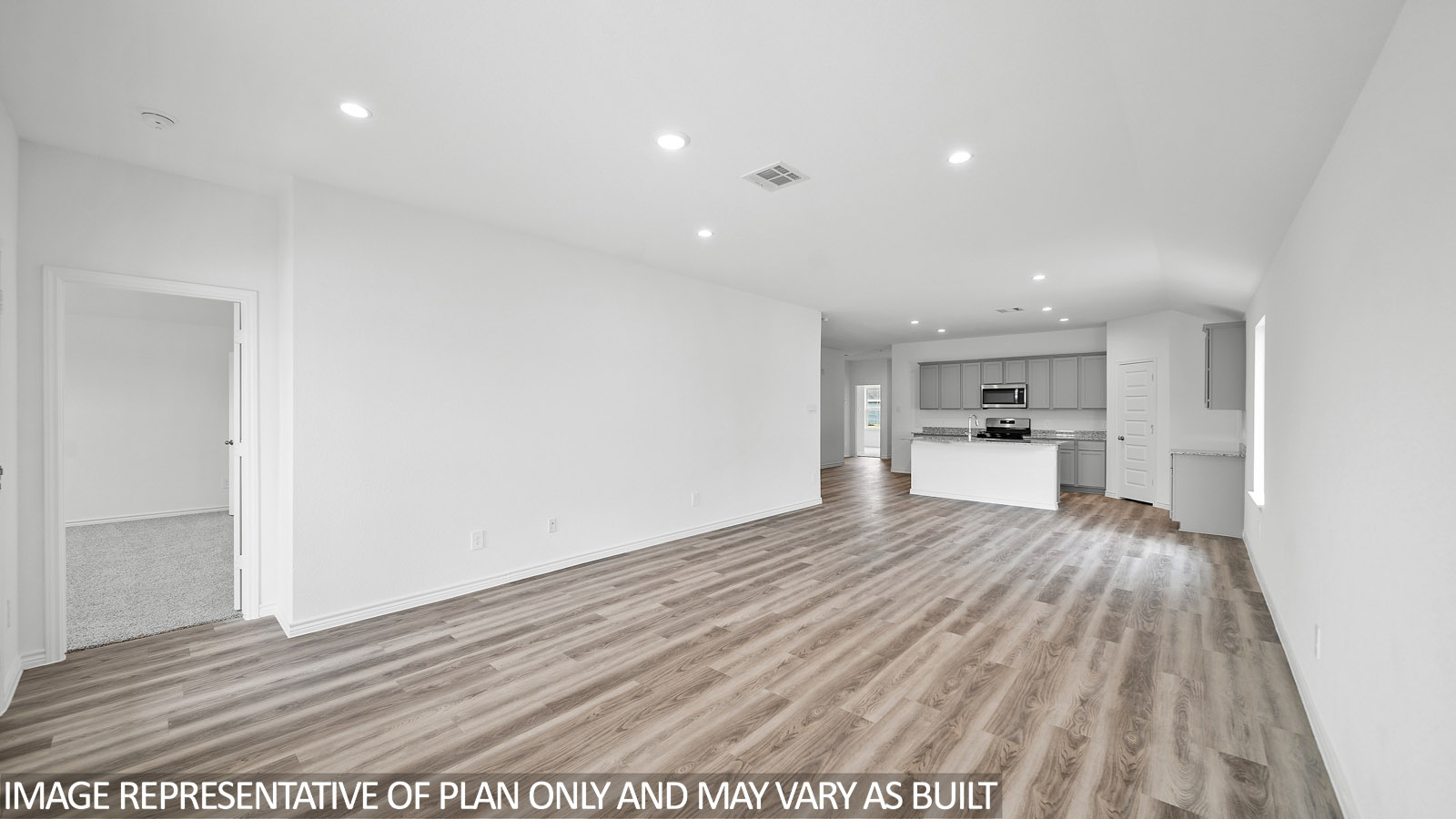 Gaven living room with vinly plank flooring and view to the kitchen.