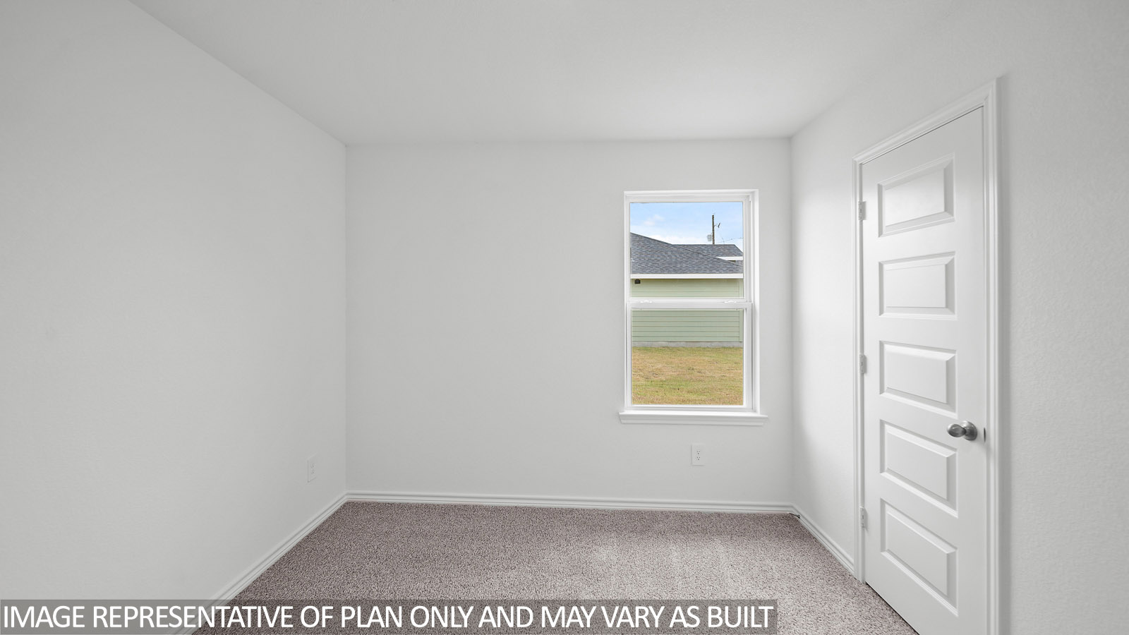 Gaven secondary bedroom with carpet flooring and window.