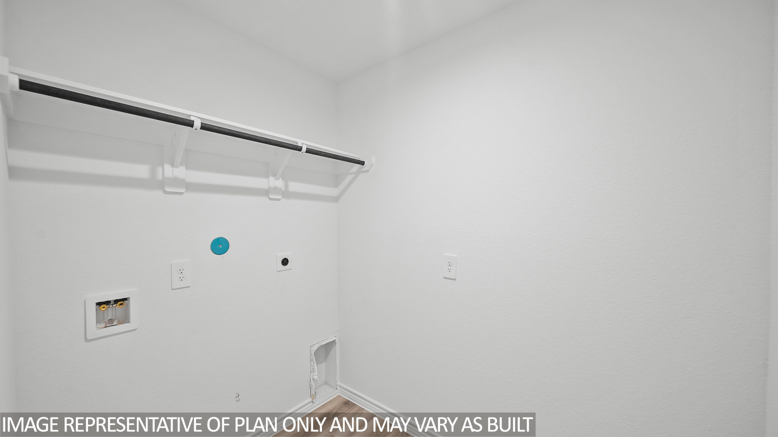 Gaven utility room with shelf and hanging rod.