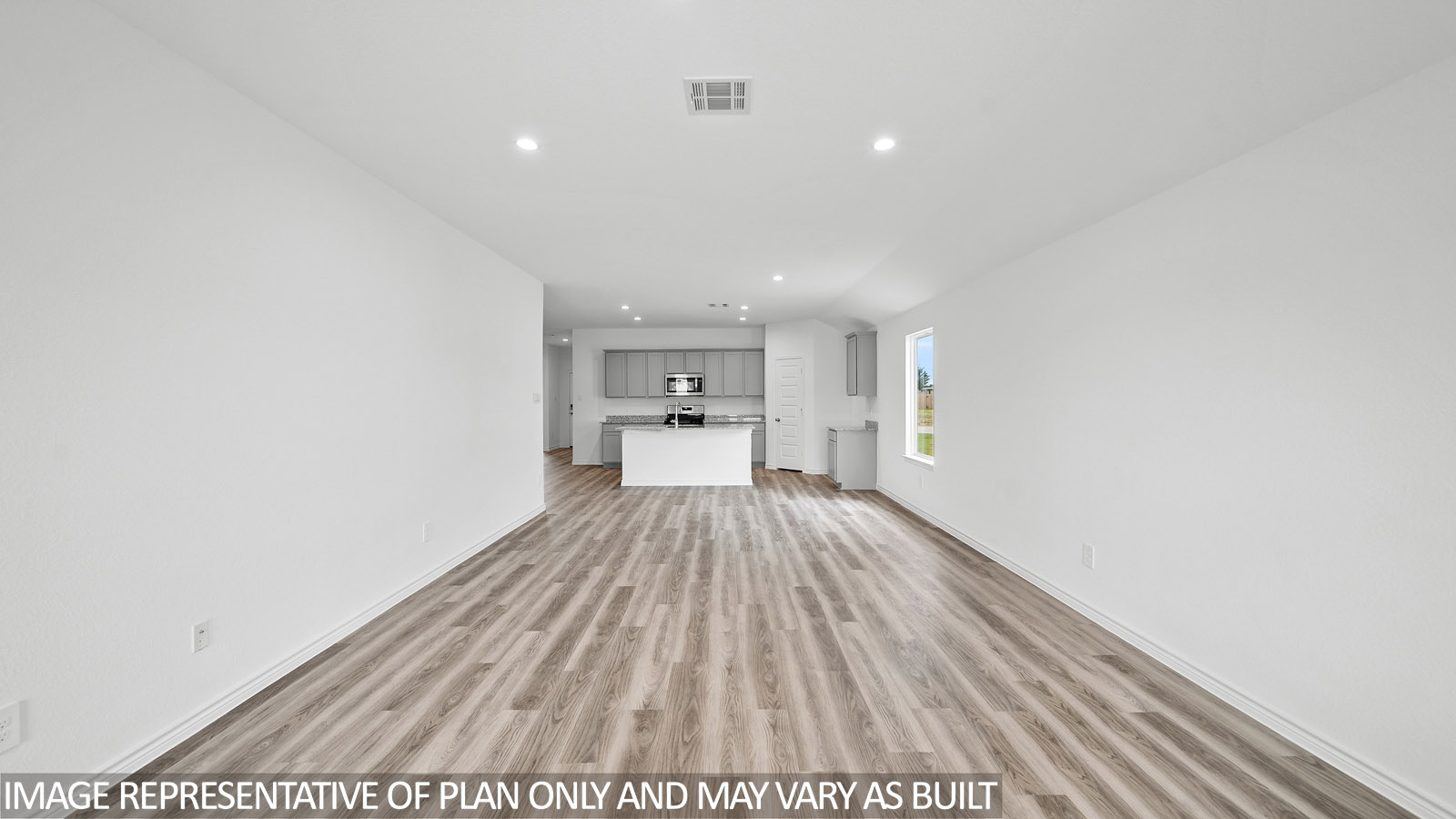 Gaven living room with vinly plank flooring and view to the kitchen.