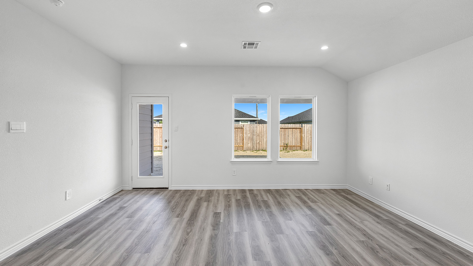 Harris living room open concept with view of the back yard.