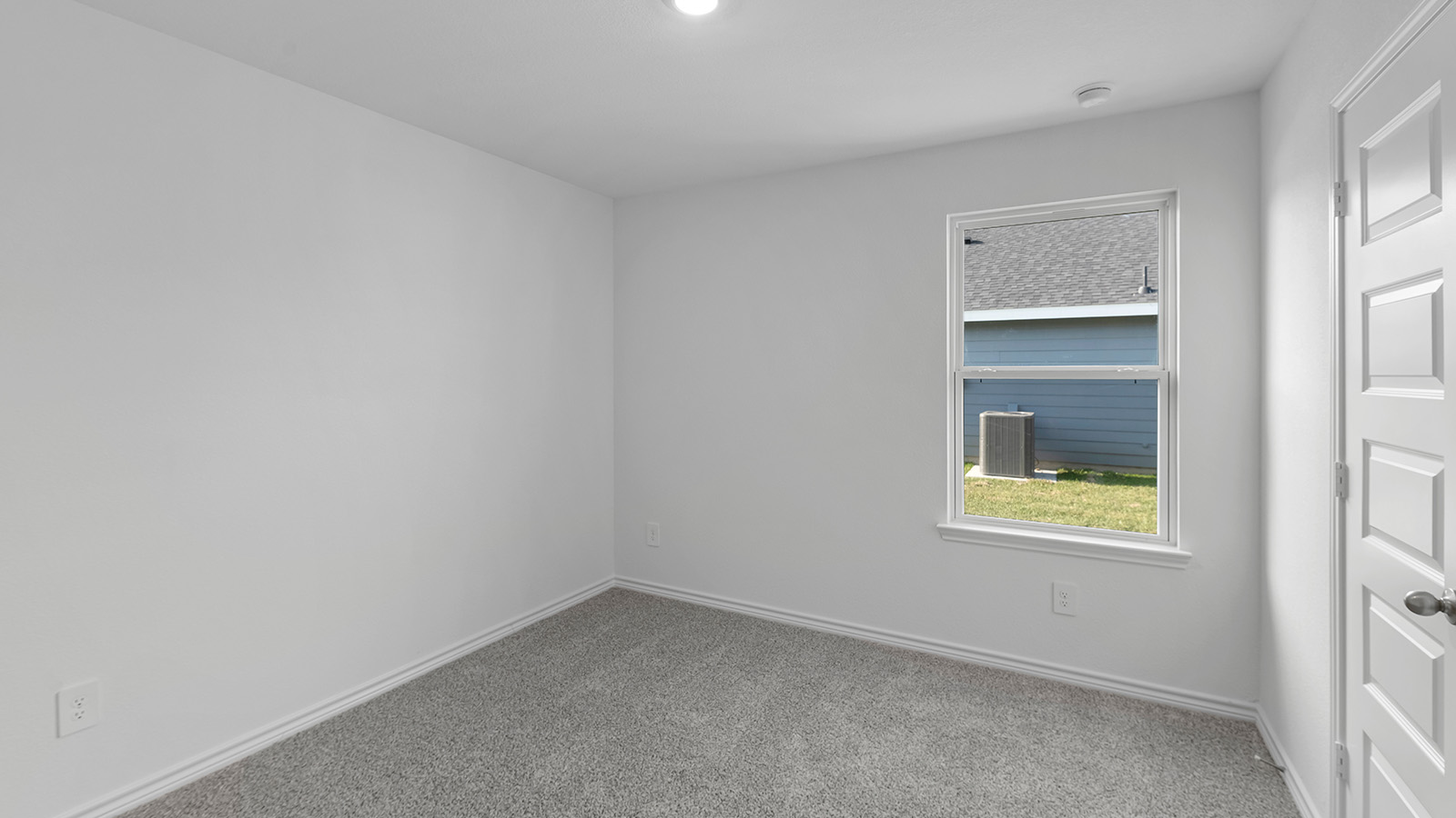 Harris secondary bedroom with carpet flooring and shower.