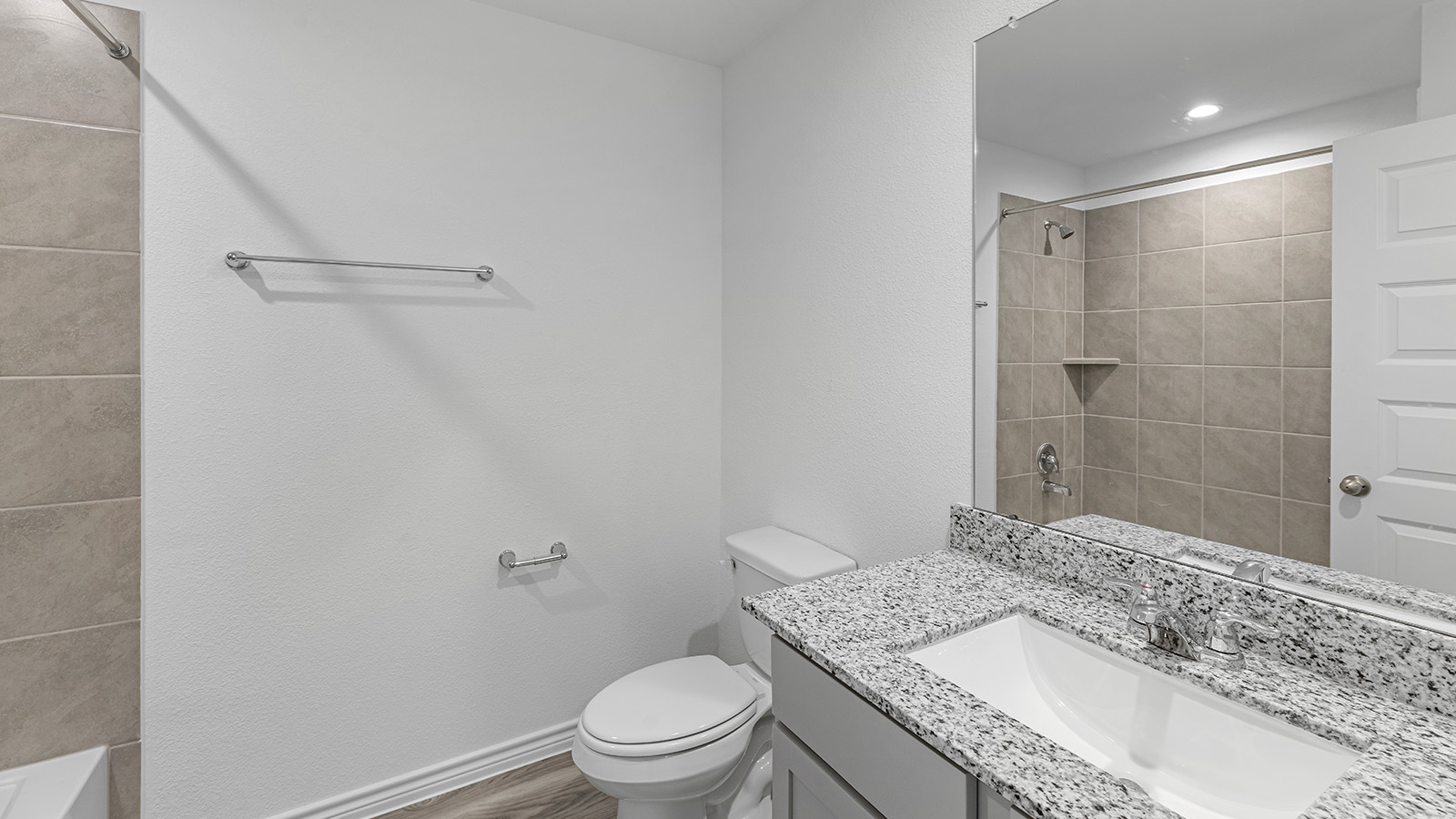 Harris secondary bathroom with vanity sink and mirror.