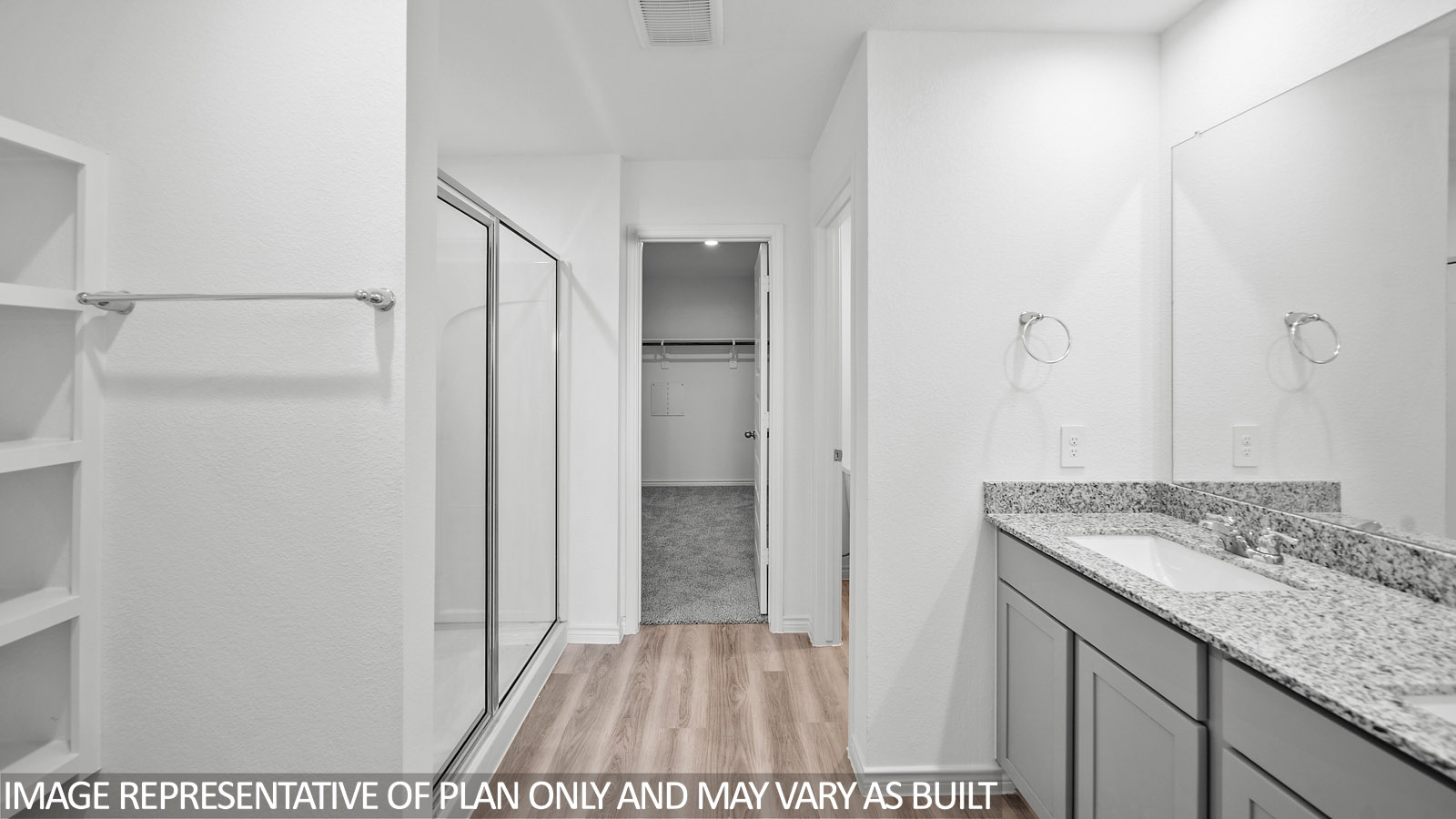 Harris primary bath with vinyl plank flooring, granite countertops and gray cabinets.