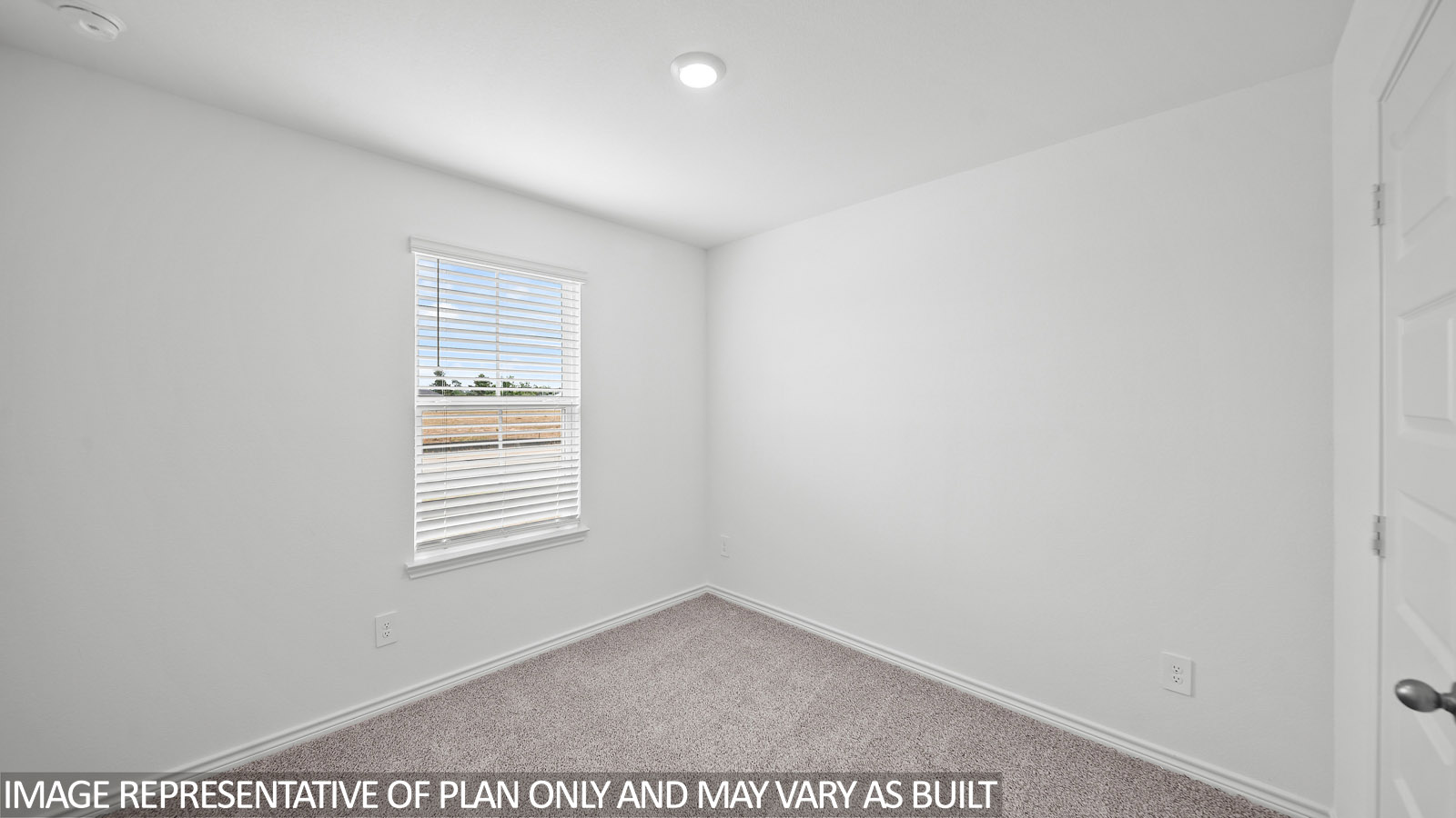 Harris secondary bedroom with carpet and window.