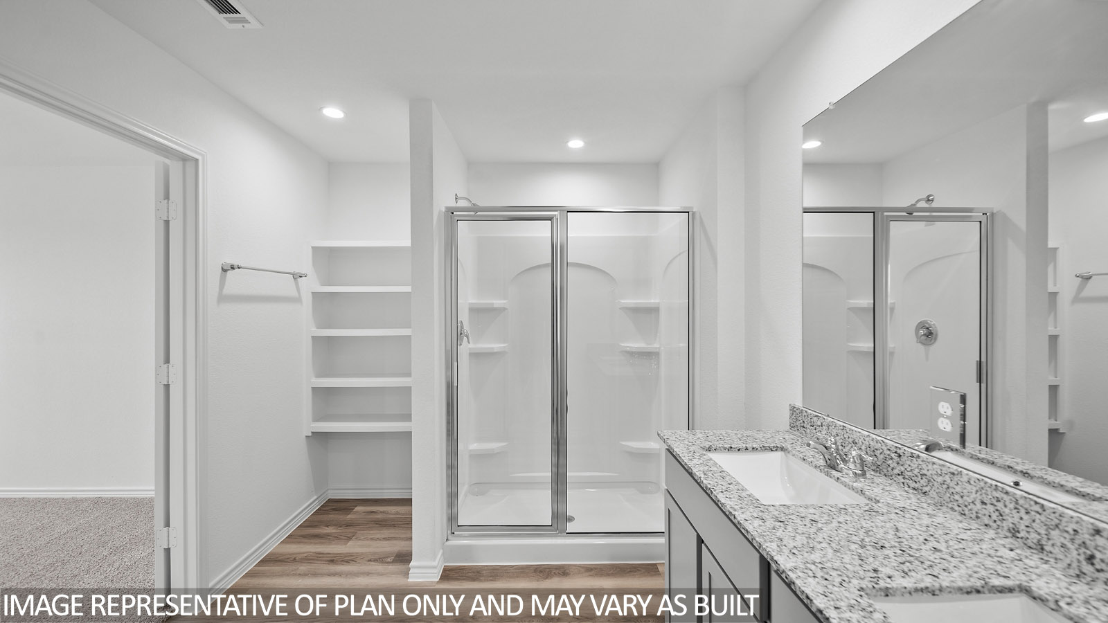 Gaven primary bathroom with glass shower enclosure and storage space.