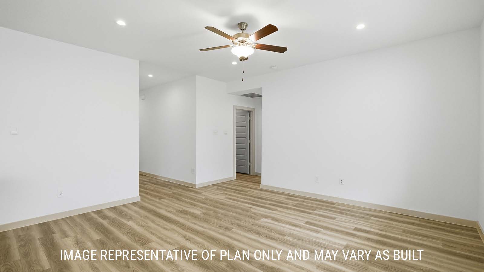 Bellvue living room with vinyl plank flooring and view of primary bedroom.