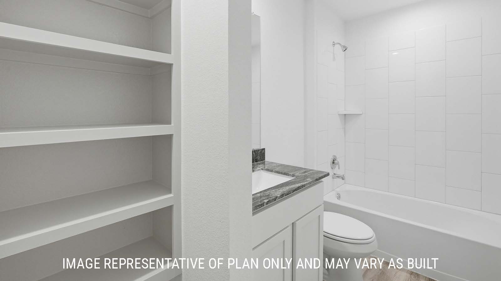 Bellvue secondary bathroom with shelving for storage and vanity sink.