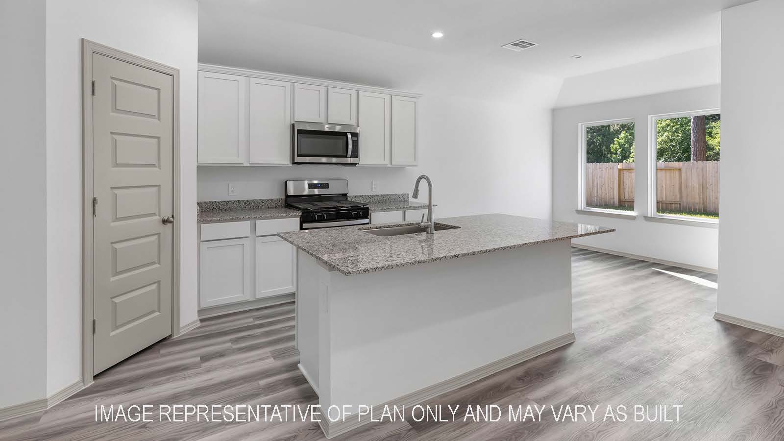 Bellvue kitchen island with light cabinets and granite countertops.