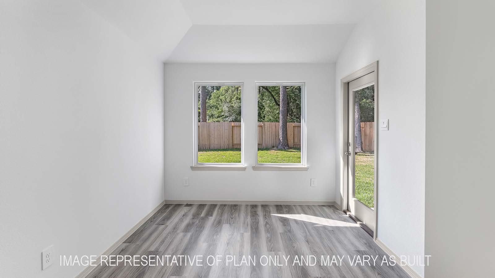 Bellvue dining room with windows and view of the backyard.