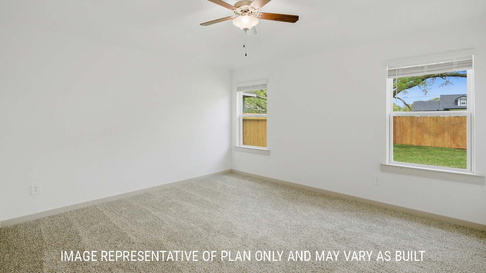 Bellvue primary bedroom with carpeted flooring and windows for natural lighting.