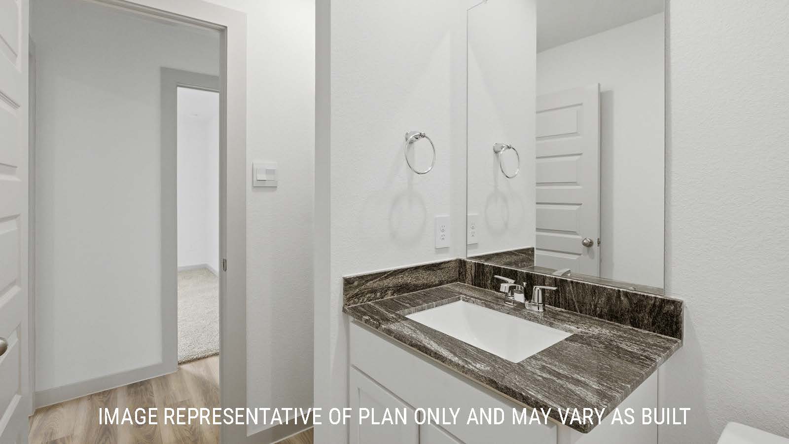 Bellvue secondary bathroom with shelving for storage and vanity sink.