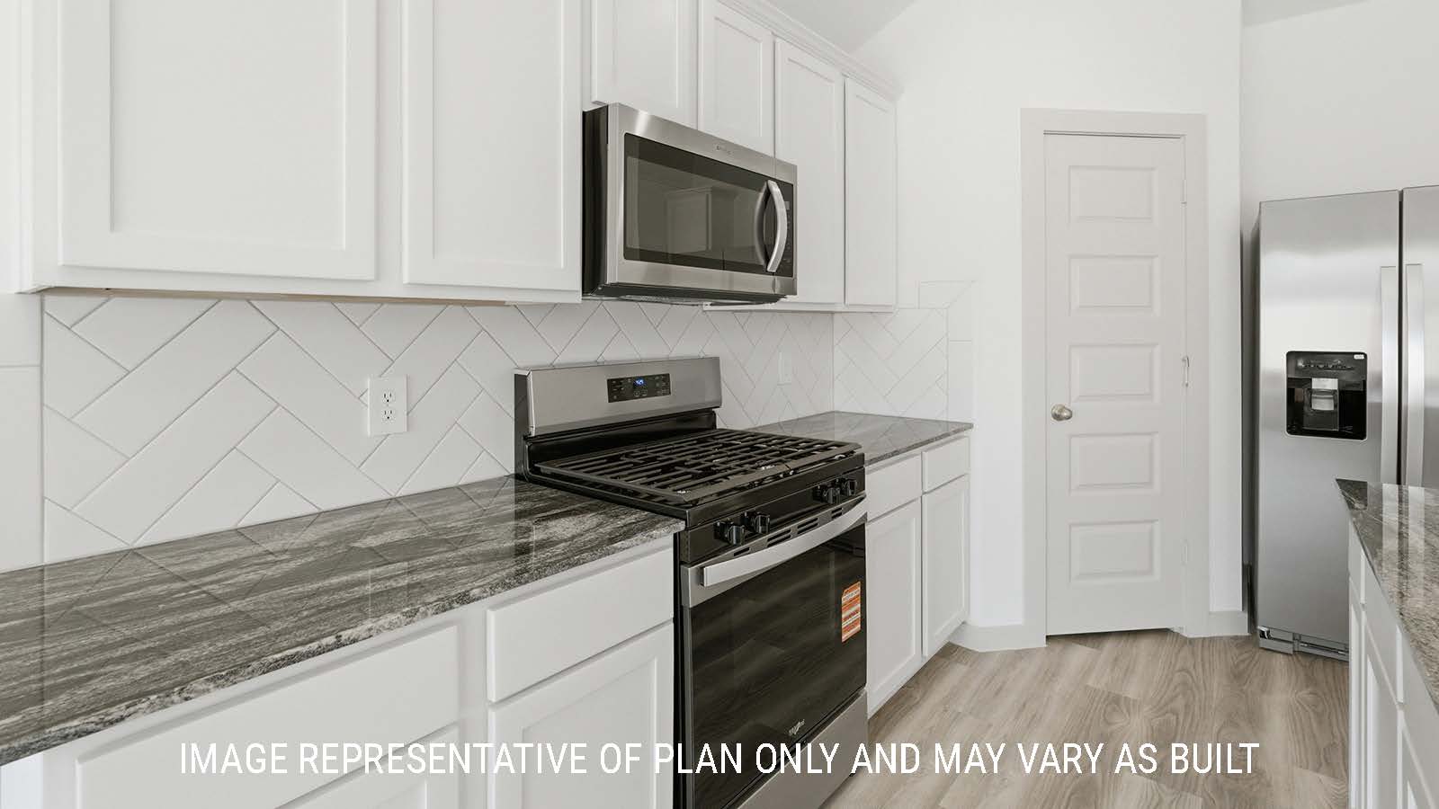 Bellvue kitchen with light countertops and dark granite countertops with stainless steel appliances.