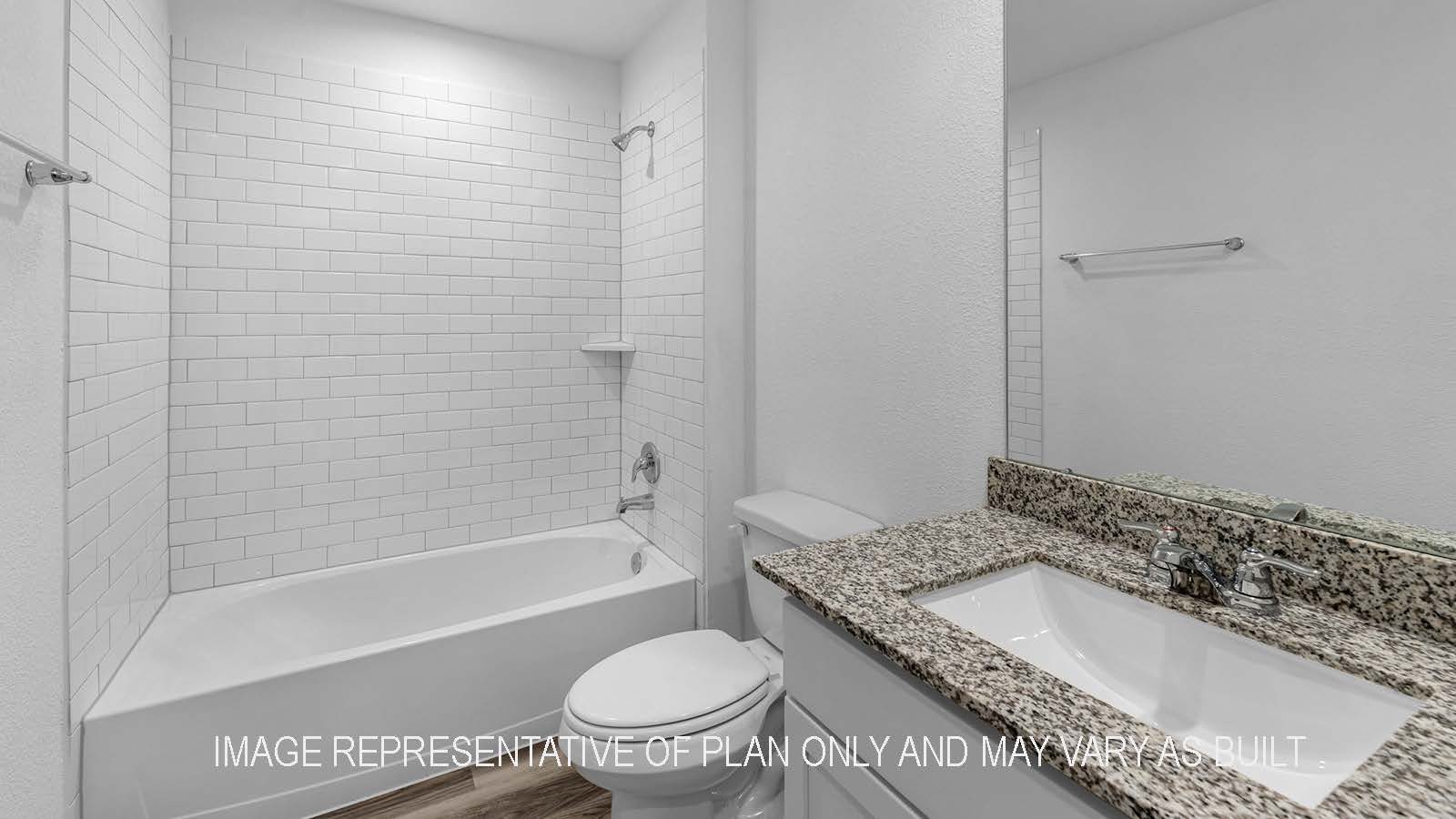 Camden secondary bathroom with vanity sink and shower and tub combo.