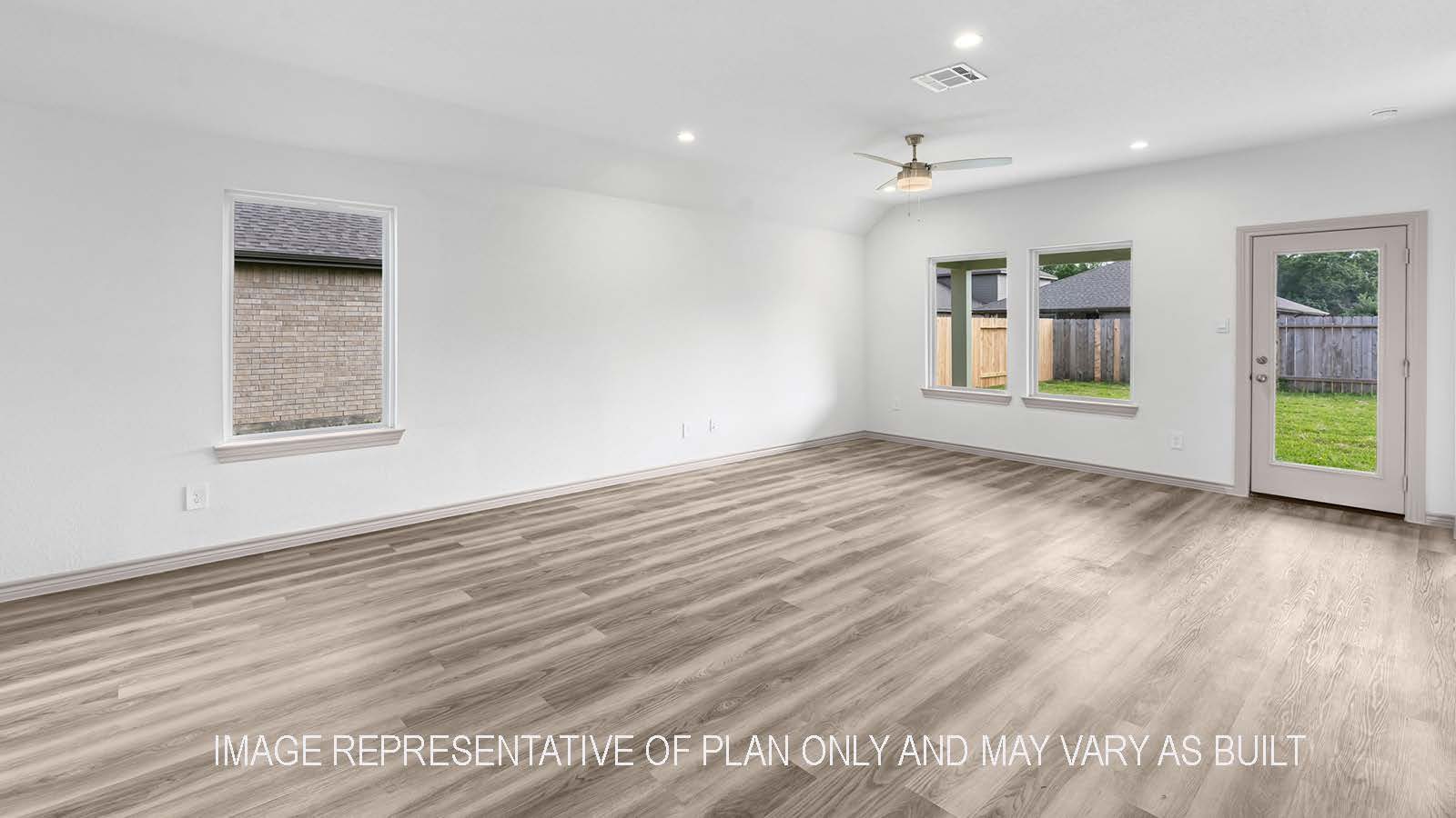 Camden living room open concept with windows and view of backyard.