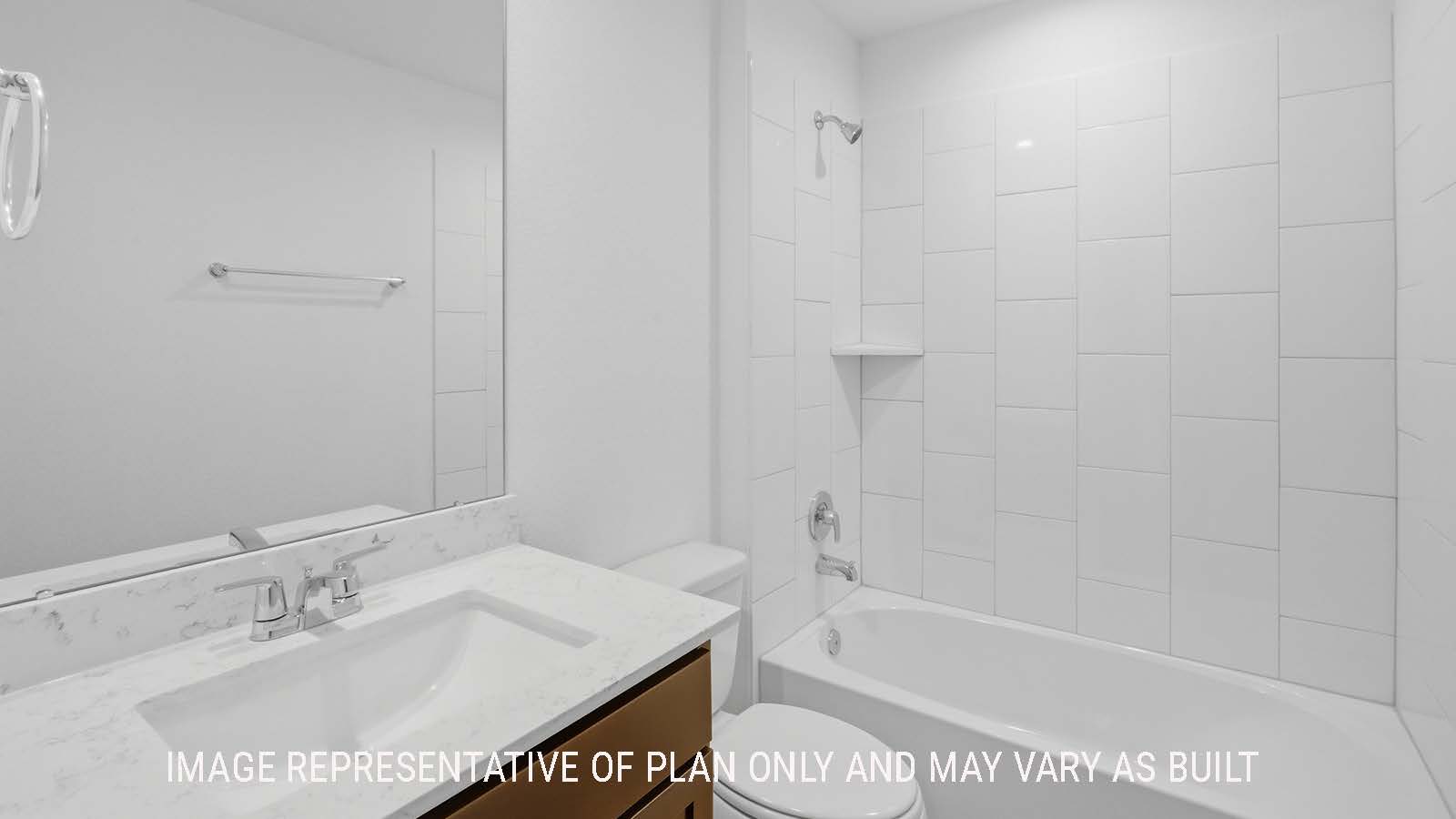 Elgin secondary bathroom with vanity sink and shower and tub combo.