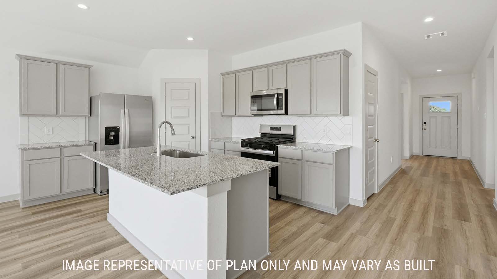 Texas Cali kitchen with kitchen island with view of front entry hallway.