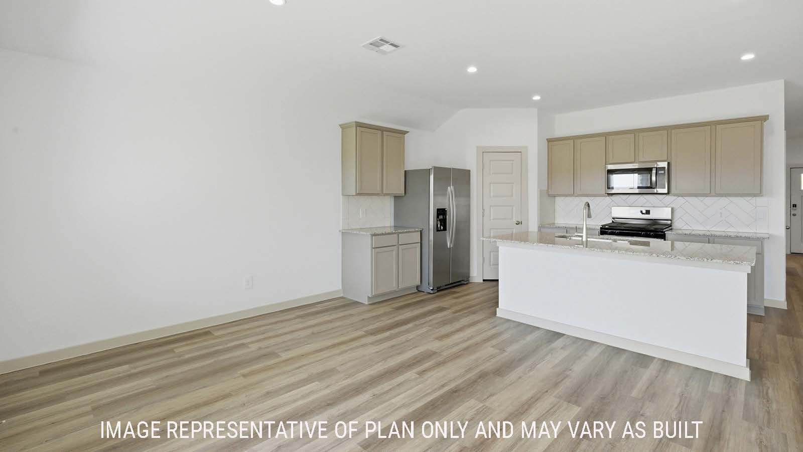 Texas Cali dining room with vinyl plank flooring and view of open concept kitchen.