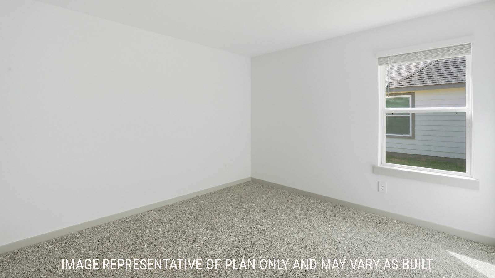 Texas Cali secondary bedroom with carpeted flooring and window for natural lighting.