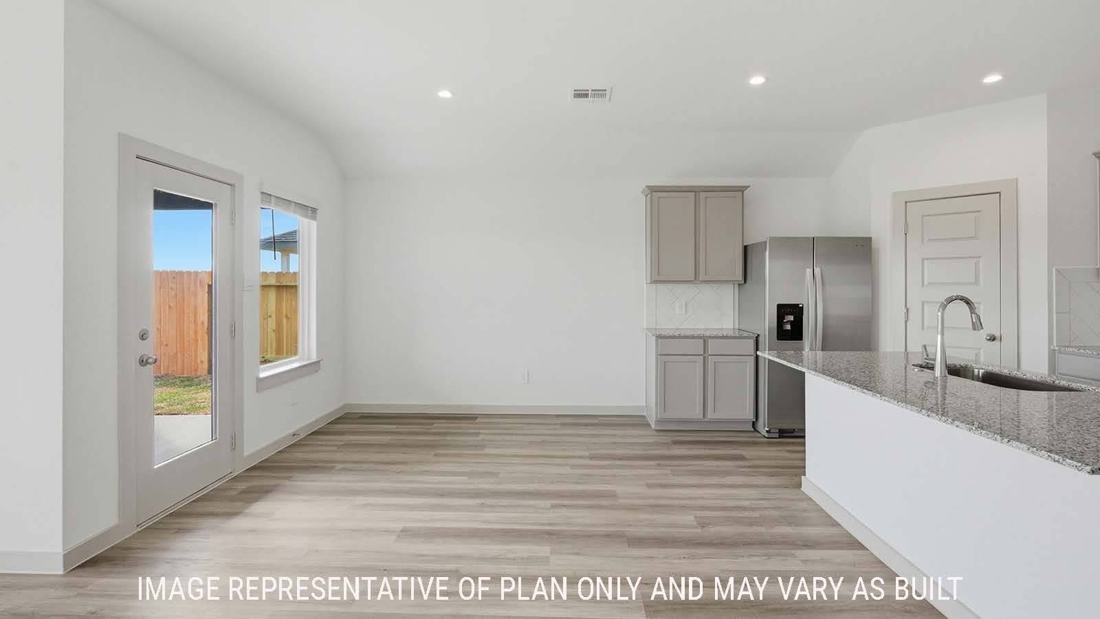 Texas Cali living room with vinyl plank flooring and windows for natural lighting.