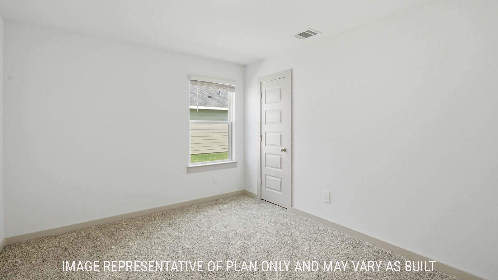 Texas Cali secondary bedroom with carpeted flooring and window for natural lighting.